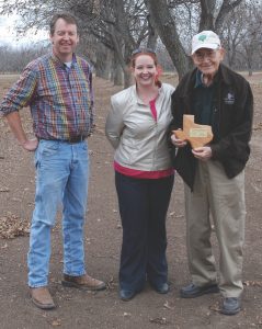 LeRoy Olsak holds his state championship plaque from the 2013 crop's Texas State Pecan Show. The nonprofit will use this pecan orchard to help vets, like LeRoy.