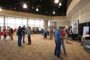 Attendees at the Georgia Pecan Growers' 2018 Conference visit with exhibitors at the trade show during one of the breaks between speakers. (Photo by Blair Krebs)