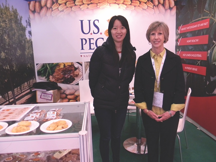 Translator Kate Wu and Ellen Burkett of Priester Pecan Co. in the U.S. Pecans booth at Food Ingredients China trade show in Shanghai. (Photo by Cindy Wise)