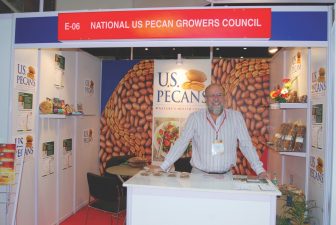 Bruce Caris of Green Valley Pecan Company stands in the U.S. Pecans' booth at Annapoorna World Food of India trade show in Mumbai, India in September 2012.