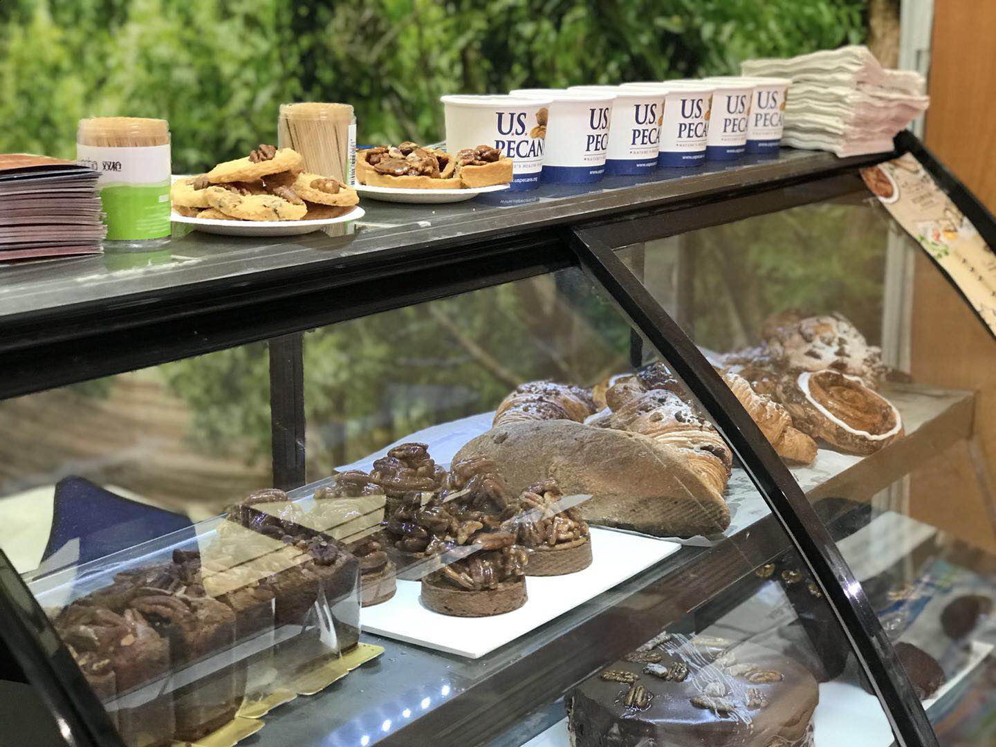 A bakery display with pecan-centric pastries.