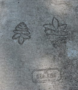 the pecan variety 'GraKing' is etched into the sidewalk on the trail
