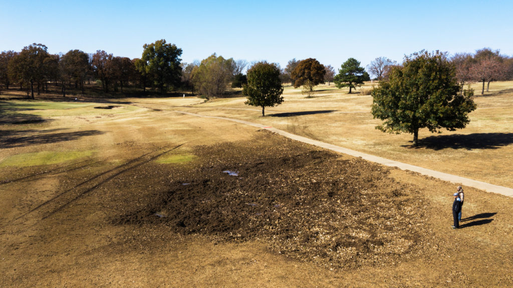 An aerial view of damage on a golf course caused by wild hogs.