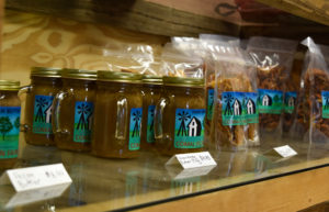 Rows of pecan butter and brittle on a shelf at the Comal Pecan Farm retail store.