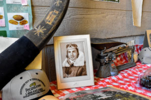 An old photograph of LeRoy Olsak in his pilot gear sits on display in the cleaning plant. The nonprofit will use this pecan orchard to help vets.