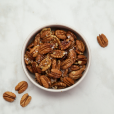 A bowl of roasted pecans. This is the featured photo for an article on the APC Electronic Reporting Platform.