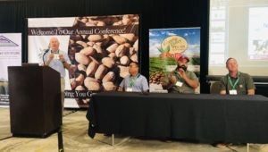 A panel of growers sit and talk to the crowd at the Arizona Pecan Growers Association 2021.