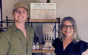 Holt Oliver and Maria Acosta at Oliver Pecan Company in San Saba, where a Texas heritage crop found an unexpected path into modern skincare.