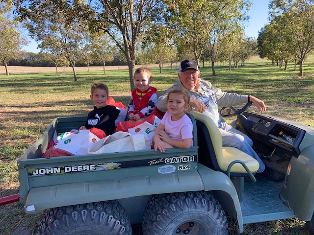 Jim and the grandkids out in the orchard. (Photo submitted by Jim Luscombe)